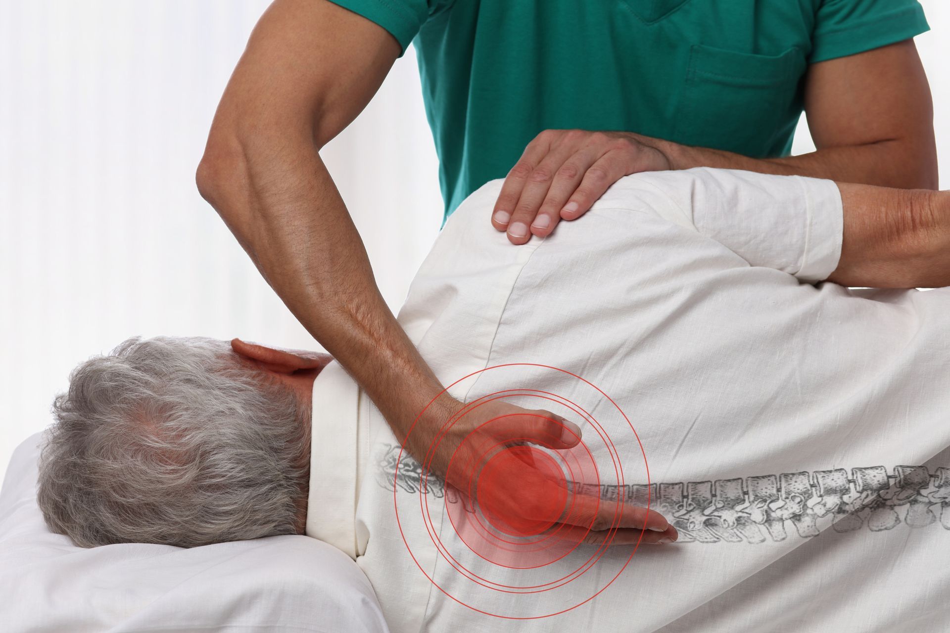 Senior man receiving care, showcasing chiropractic therapy for pain relief and physiotherapy.