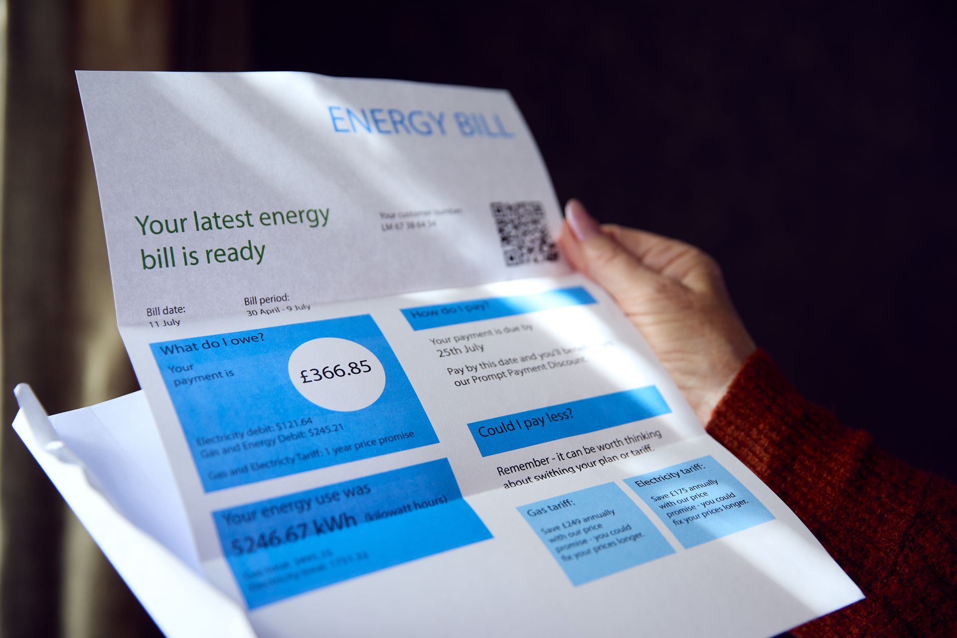 Hand holding an energy bill