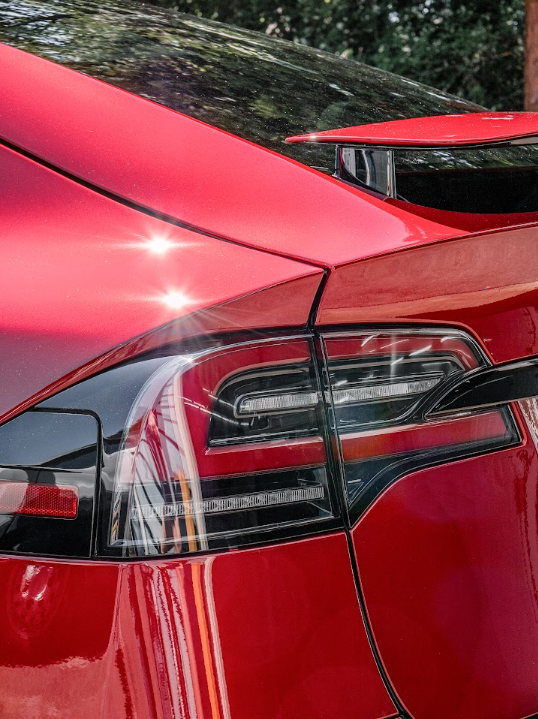 a close up of a red car 's tail light .