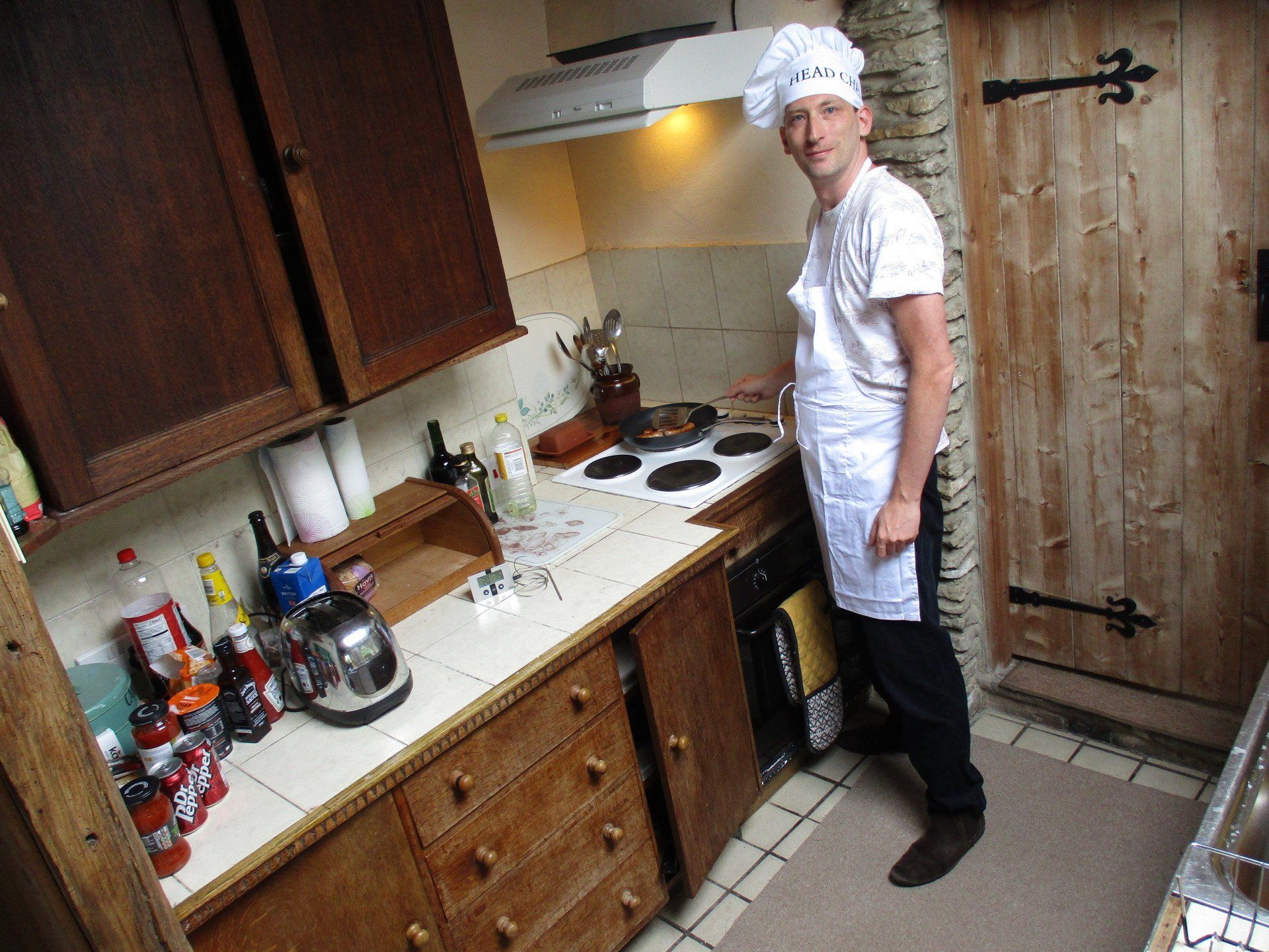 Preparing a cooked breakfast in the kitchen of Fraser's Fryups