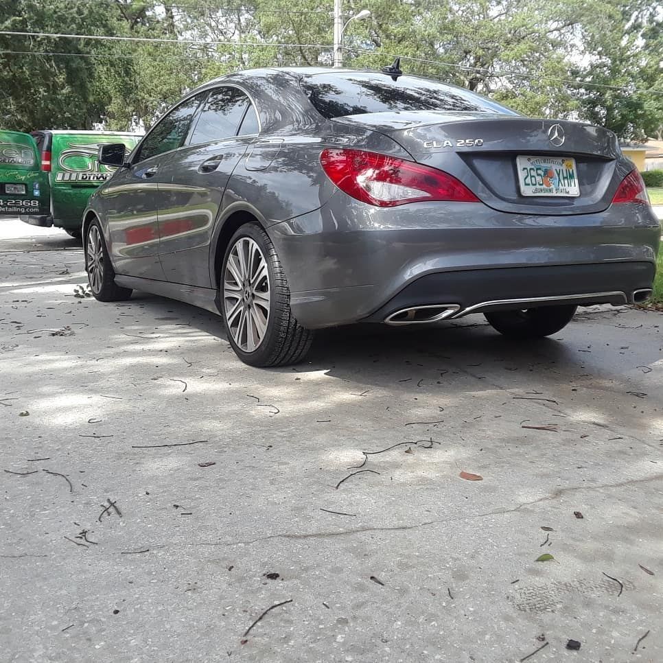 A mercedes benz is parked in a parking lot