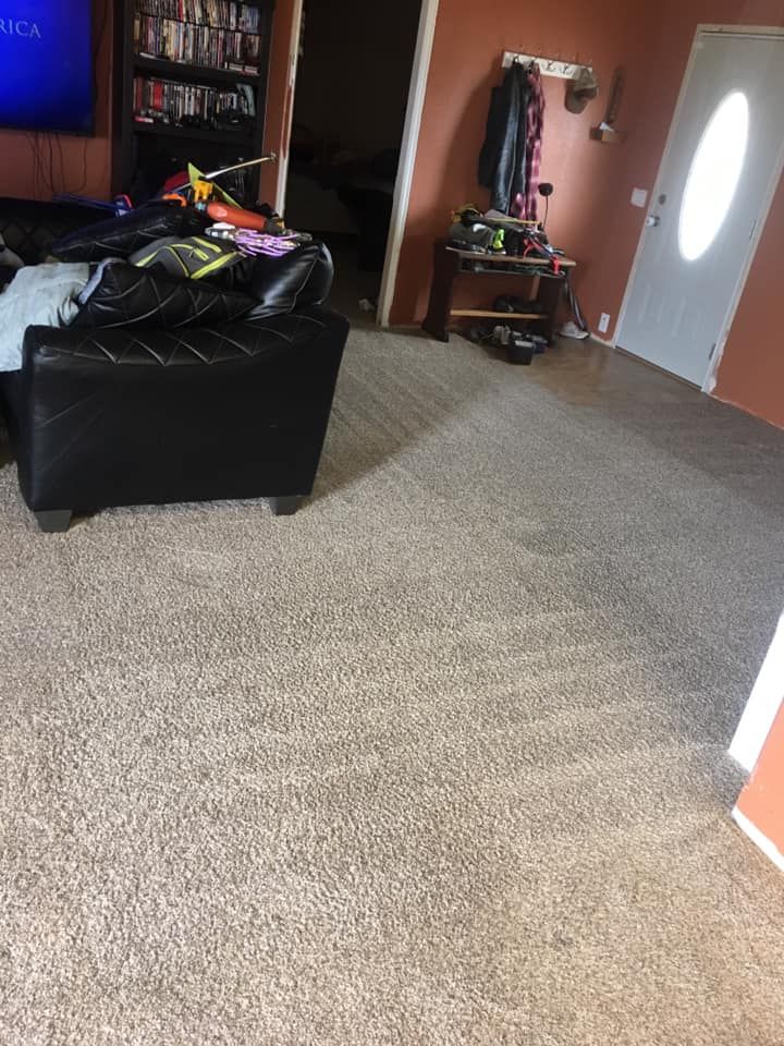 White car wheel well with air suspension installed; brake rotor, caliper, and suspension components visible.