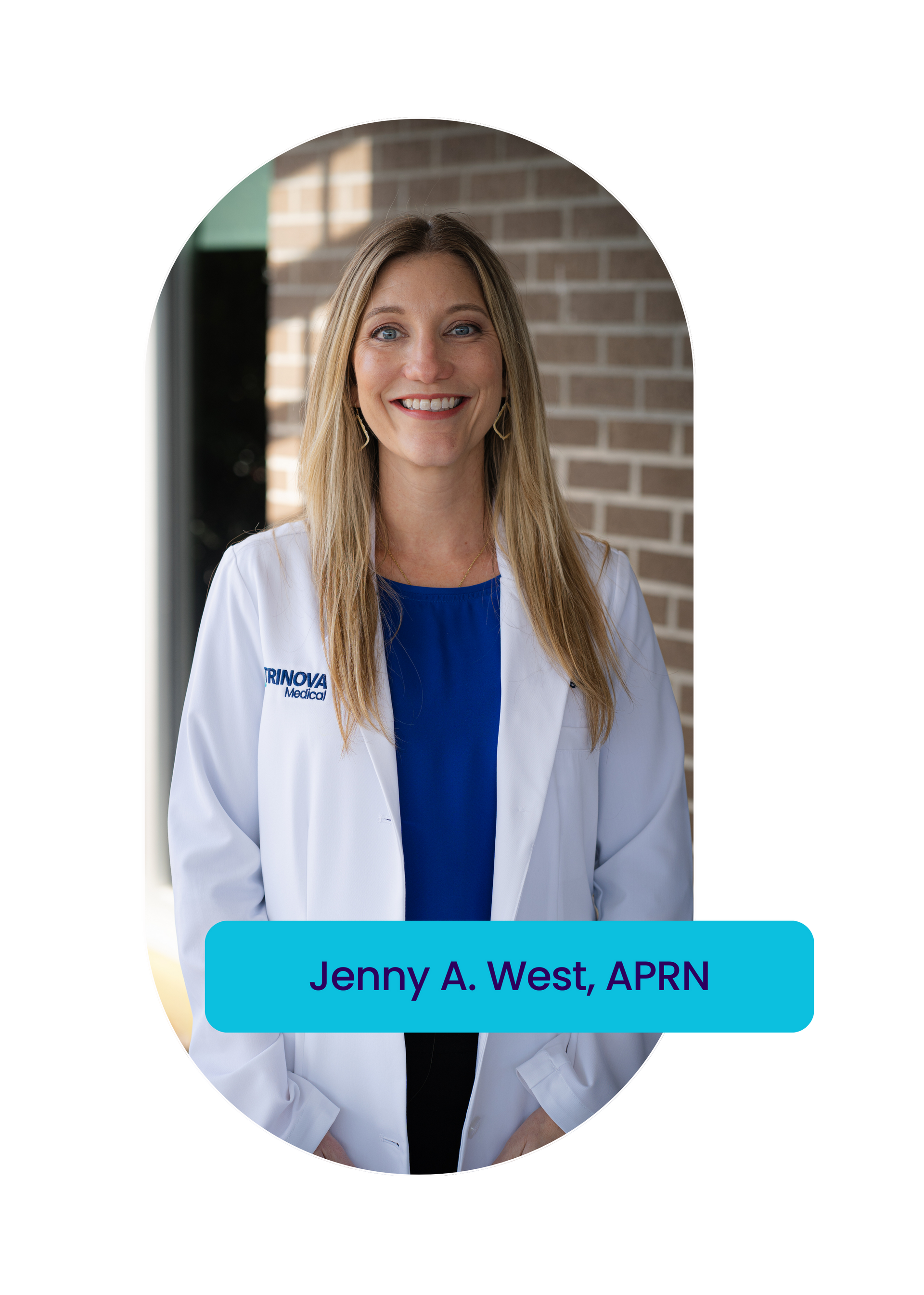 A woman in a white lab coat and blue shirt is smiling.