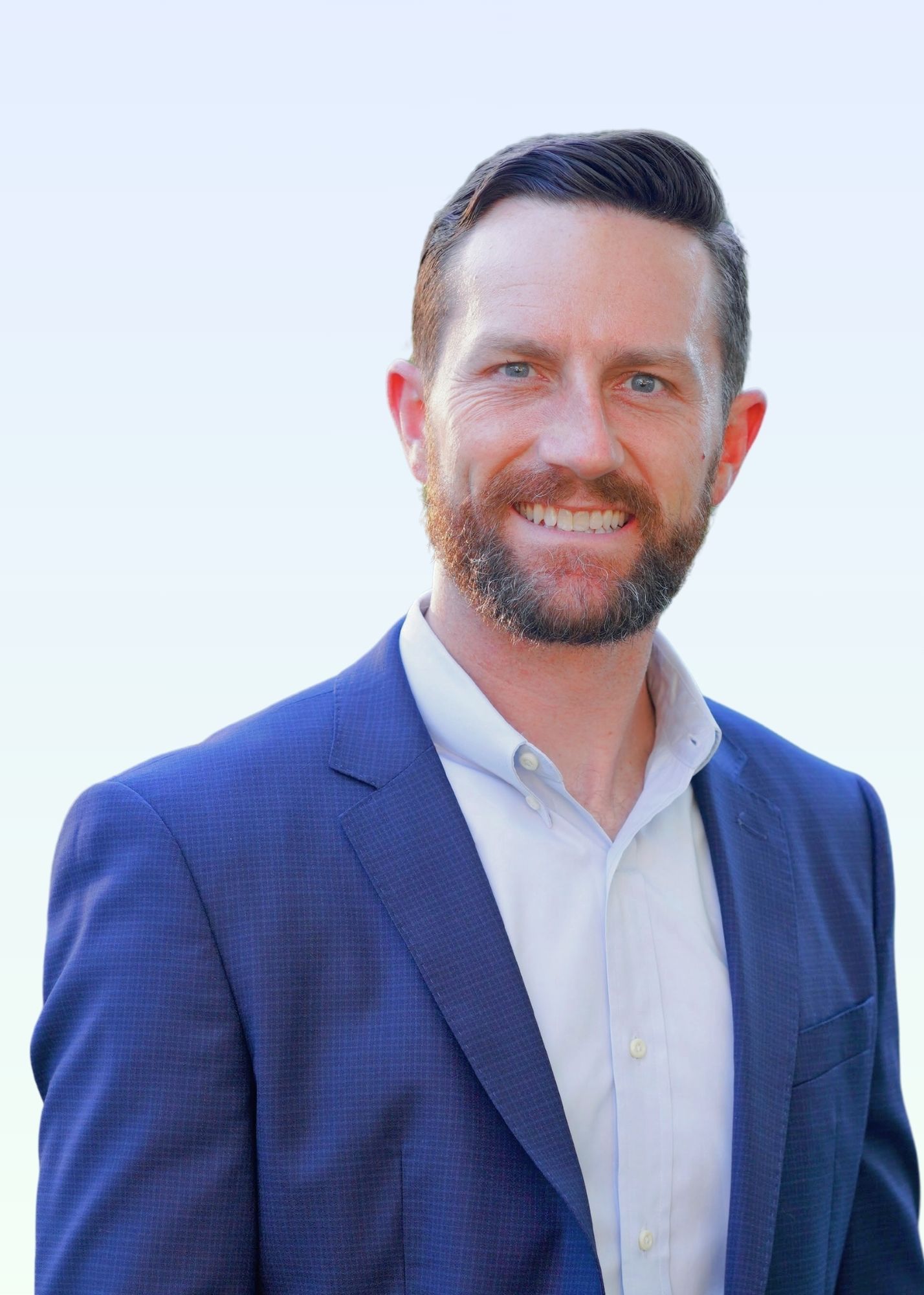 Dr. Mark Ryan MD
A man in a suit and white shirt is smiling for the camera.