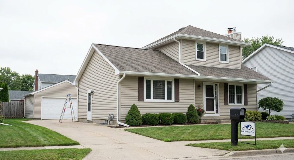 Home with a gutter installation from Erie Roofing Pros