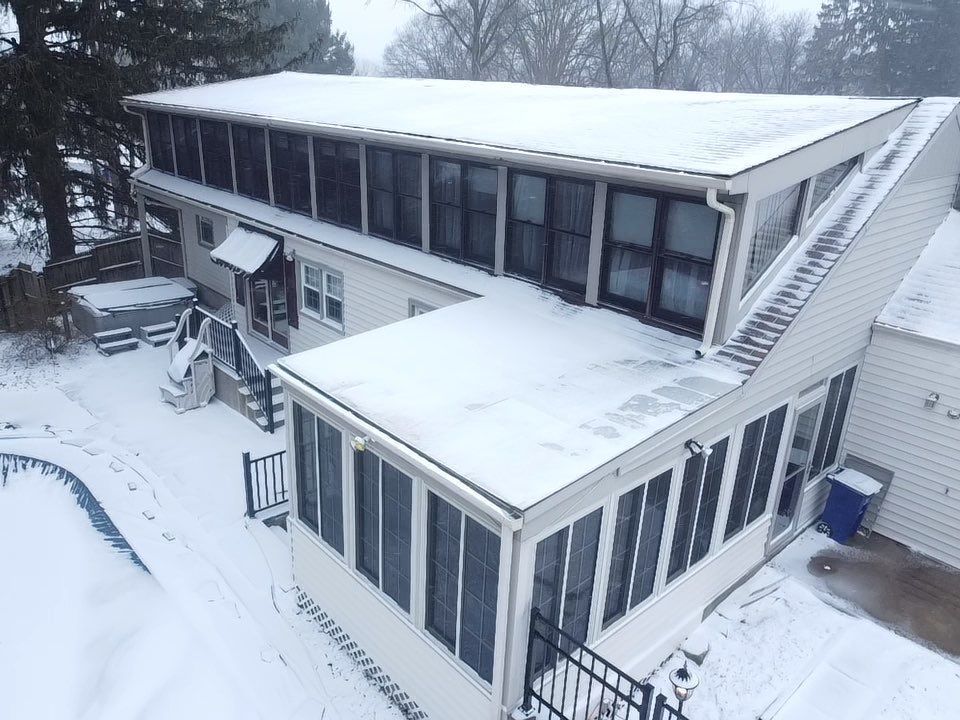 Home with a gutter installation from Erie Roofing Pros