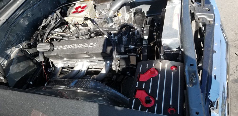 A close up of a car engine with the word chrysler on it