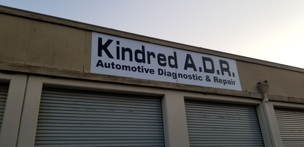 A building with a sign that says kindred a.d.r. automotive diagnostic & repair