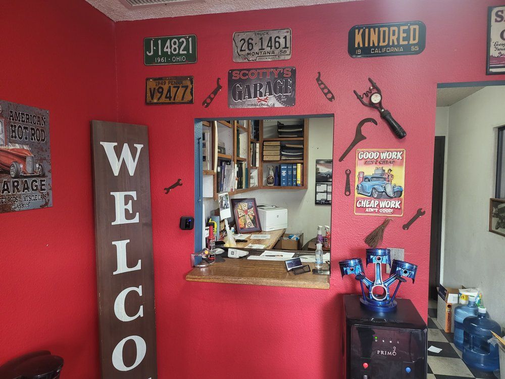 A room with a red wall and a sign that says welcome