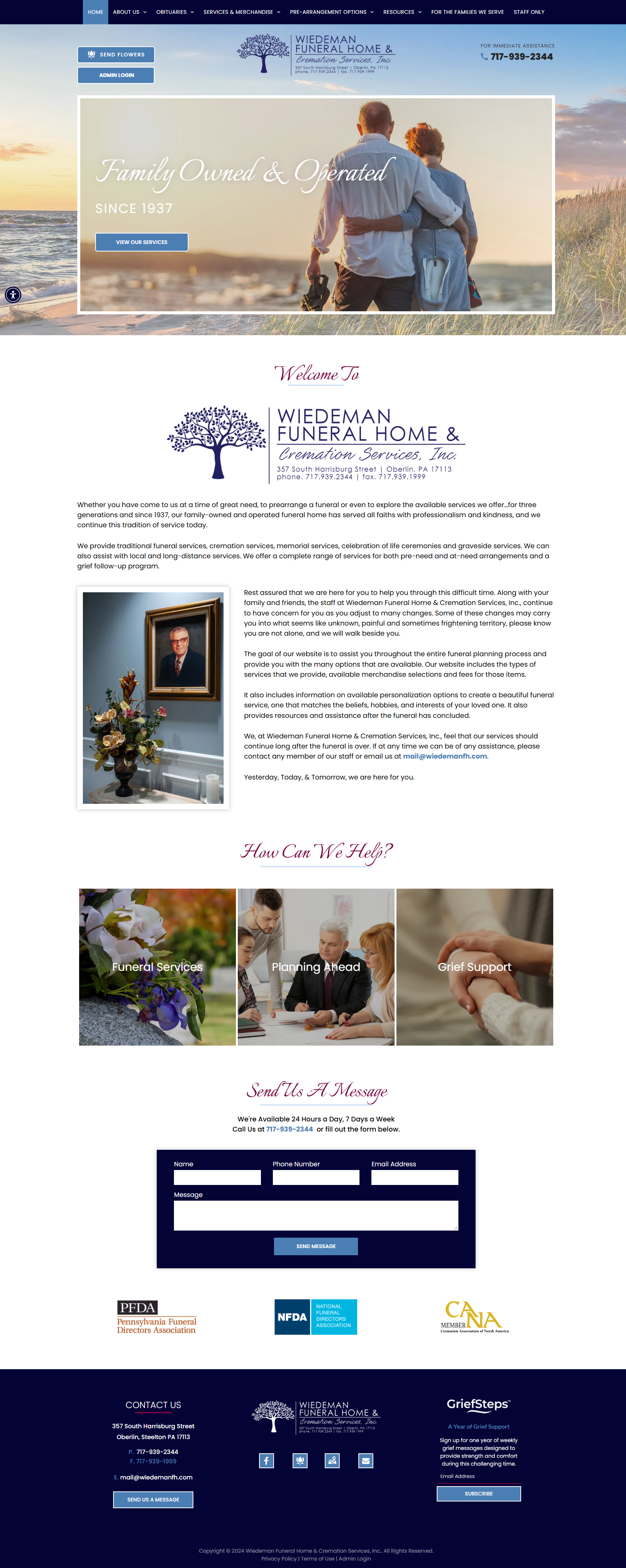 A screenshot of a website showing a couple sitting on a beach.