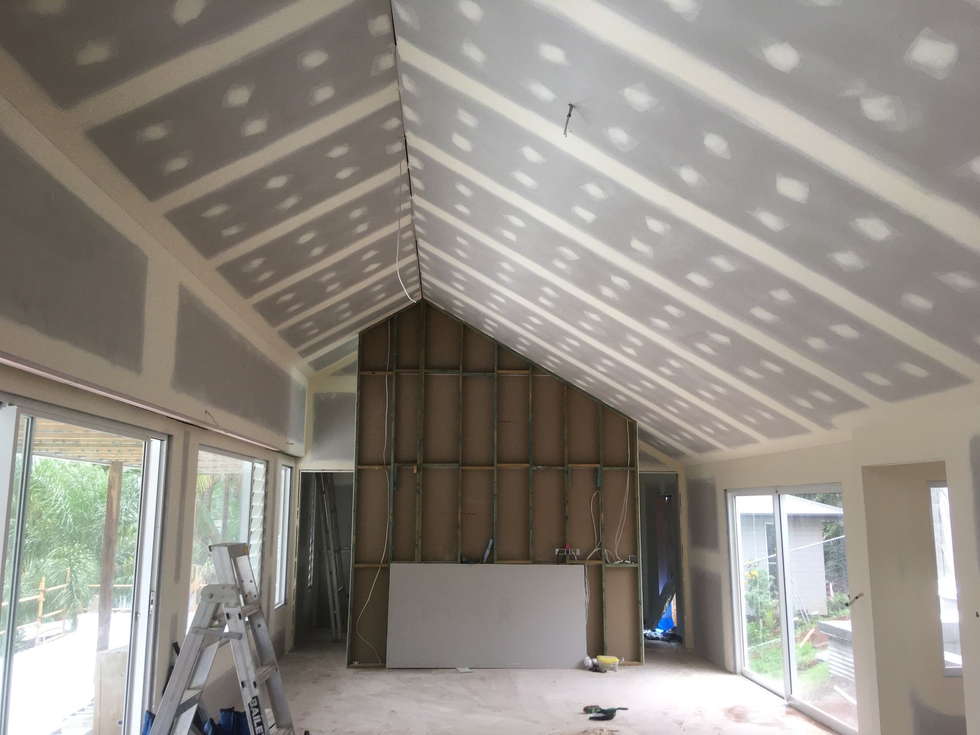 A Large Room with A Vaulted Ceiling Is Being Remodeled — Completely Plastered North Coast in Lennox Head, NSW