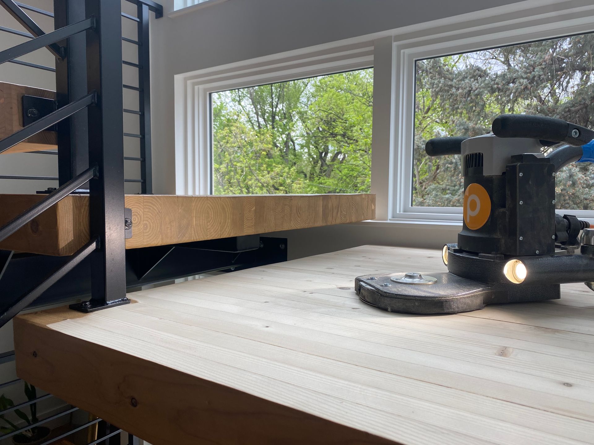 power tools on wood step of stairs