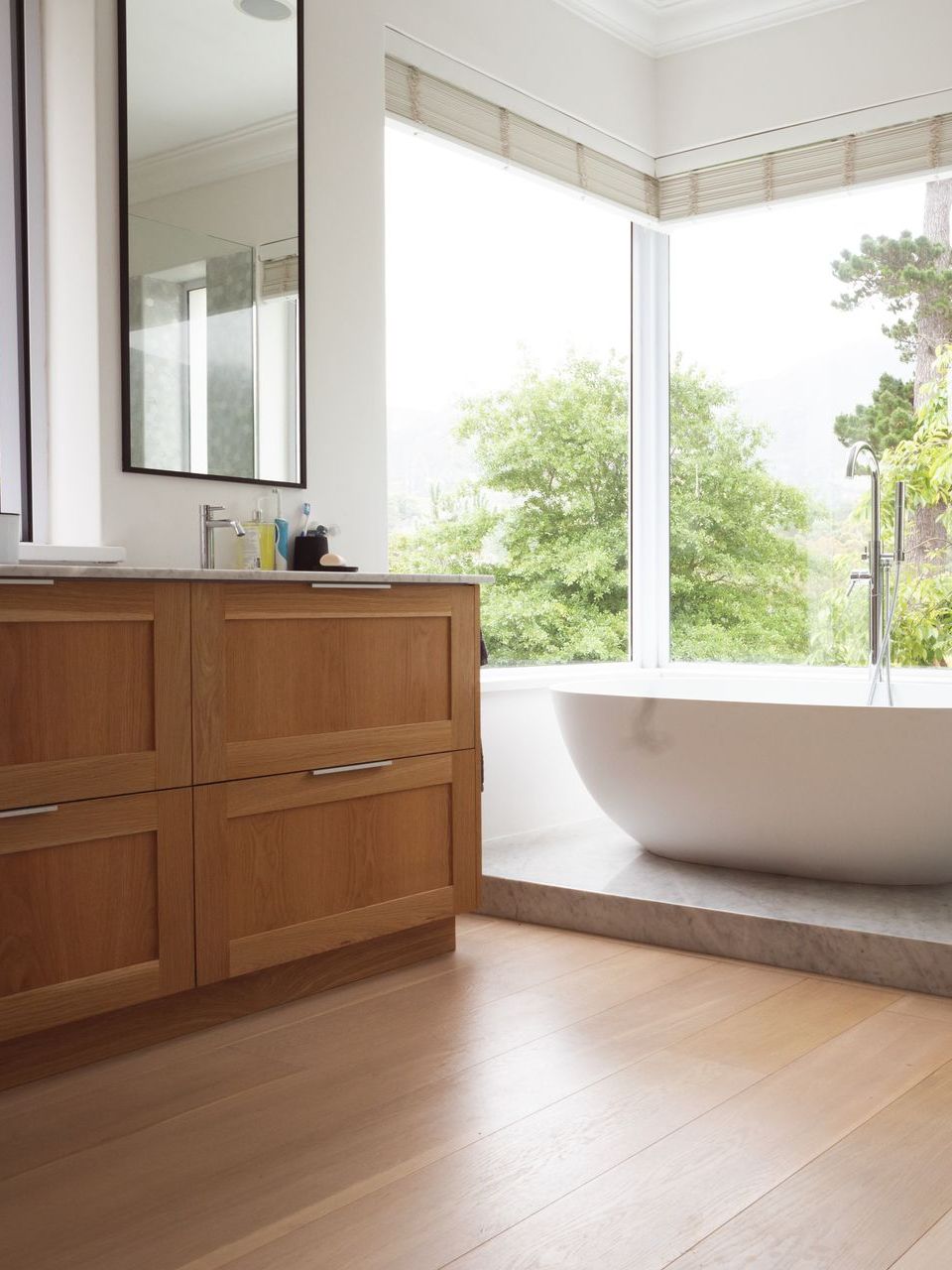 modern interior design of bathroom with wood floors
