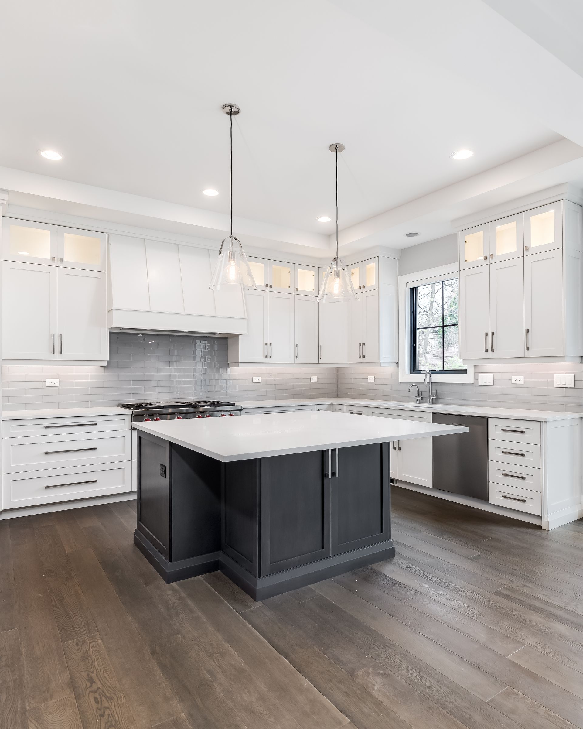 There is a large island in the middle of the kitchen.