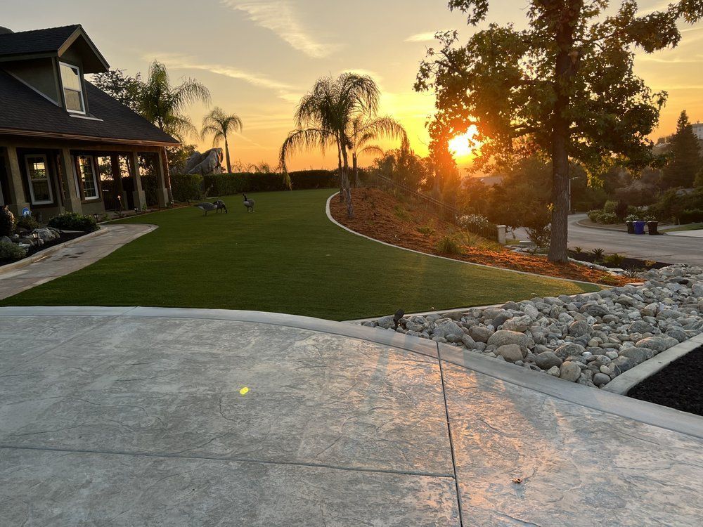 Corner two-story house with fresh concrete walkway