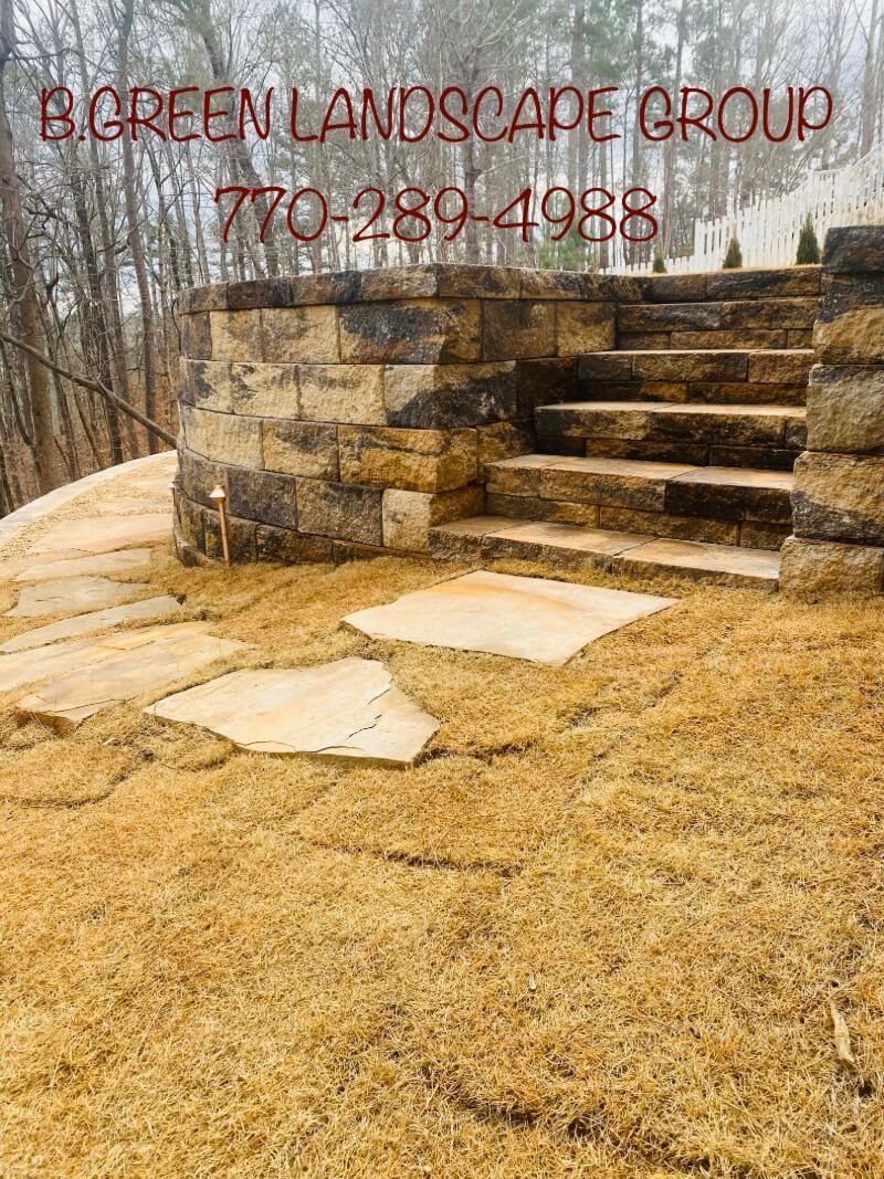 a stone walkway with stairs leading up to a stone wall .