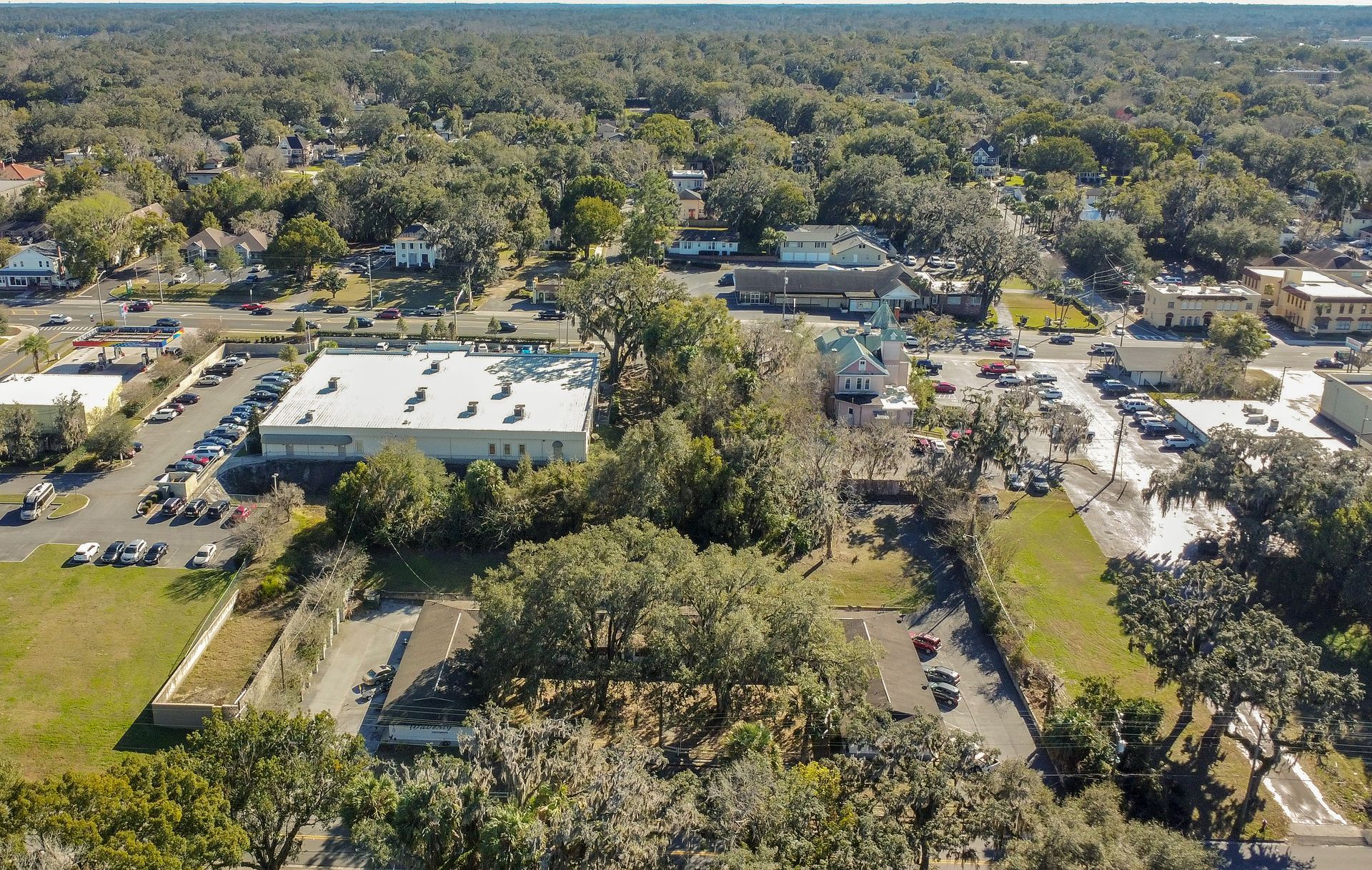 An aerial view of a city with lots of trees and buildings