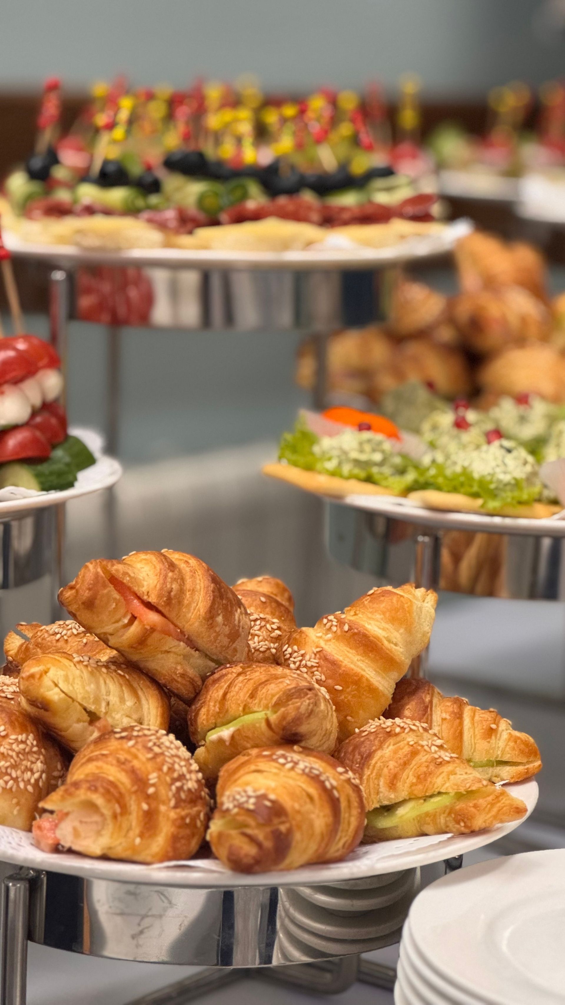 Bespoke catering brunch spread on a white-linen table