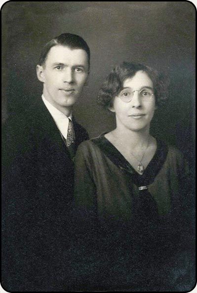 a black and white photo of a man and woman