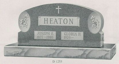 a black and white photo of a gravestone for joseph and gloria heaton .