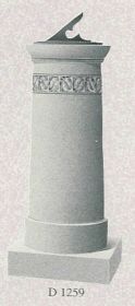 a statue of a pillar with a sundial on top of it .