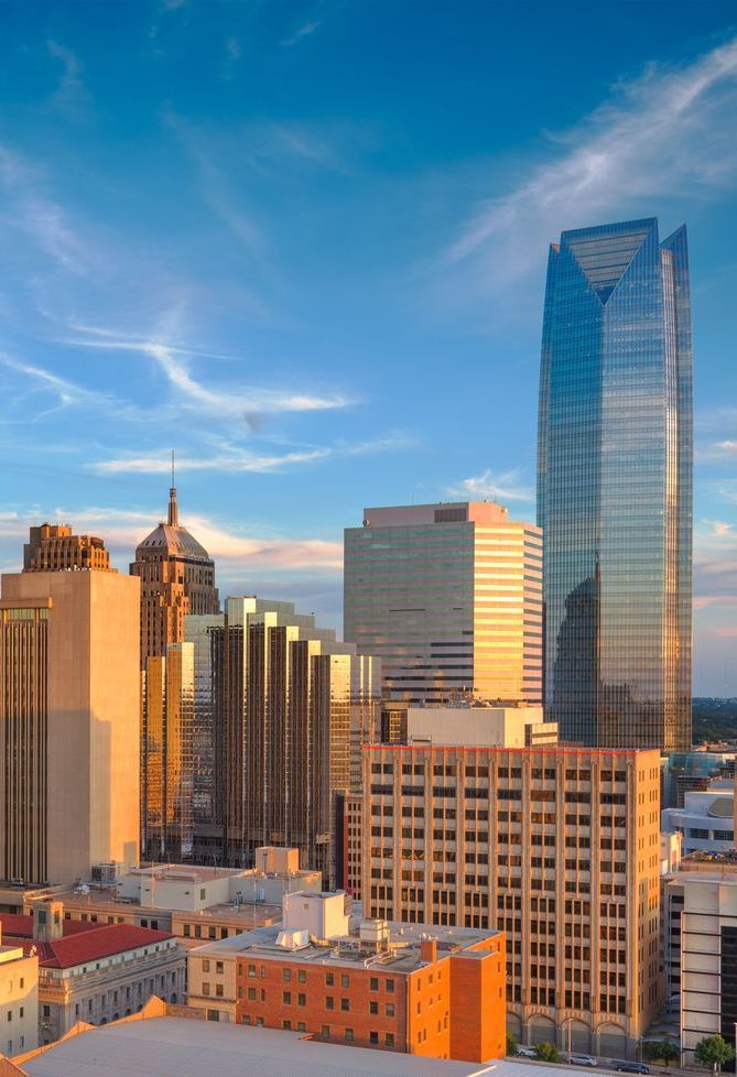 An aerial view of a city skyline at sunset.