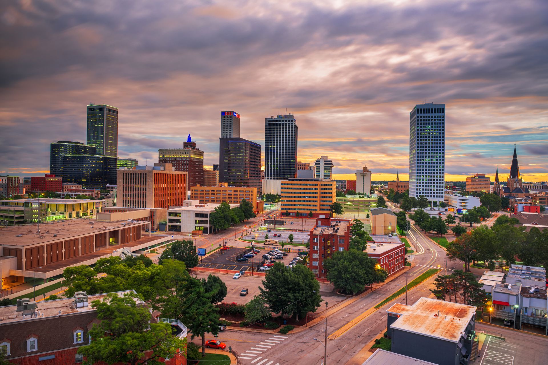An aerial view of a city skyline at sunset.