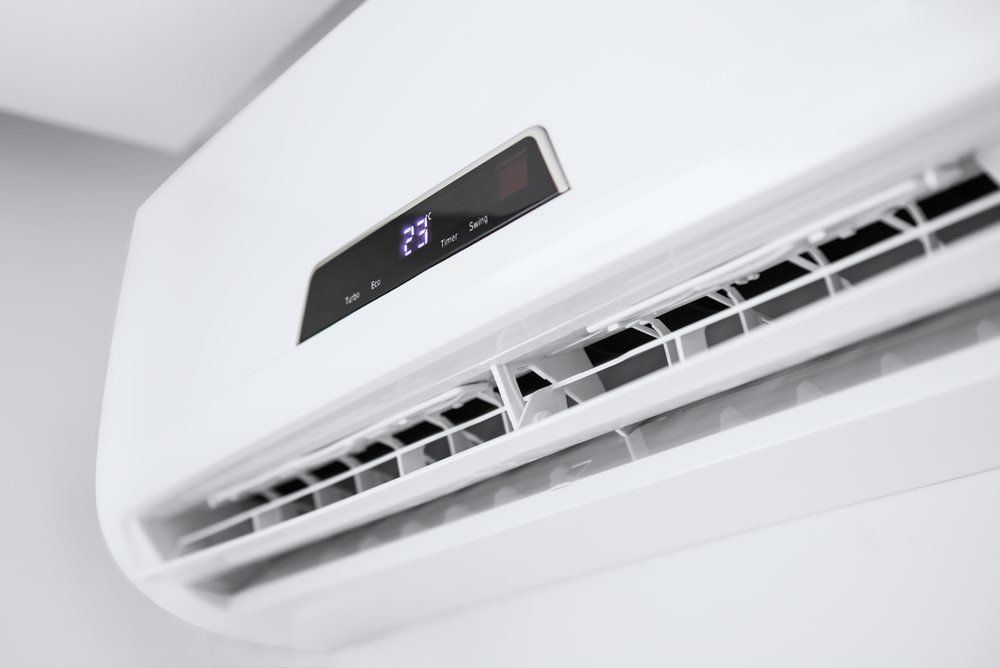 new white split system air conditioner mounted on wall