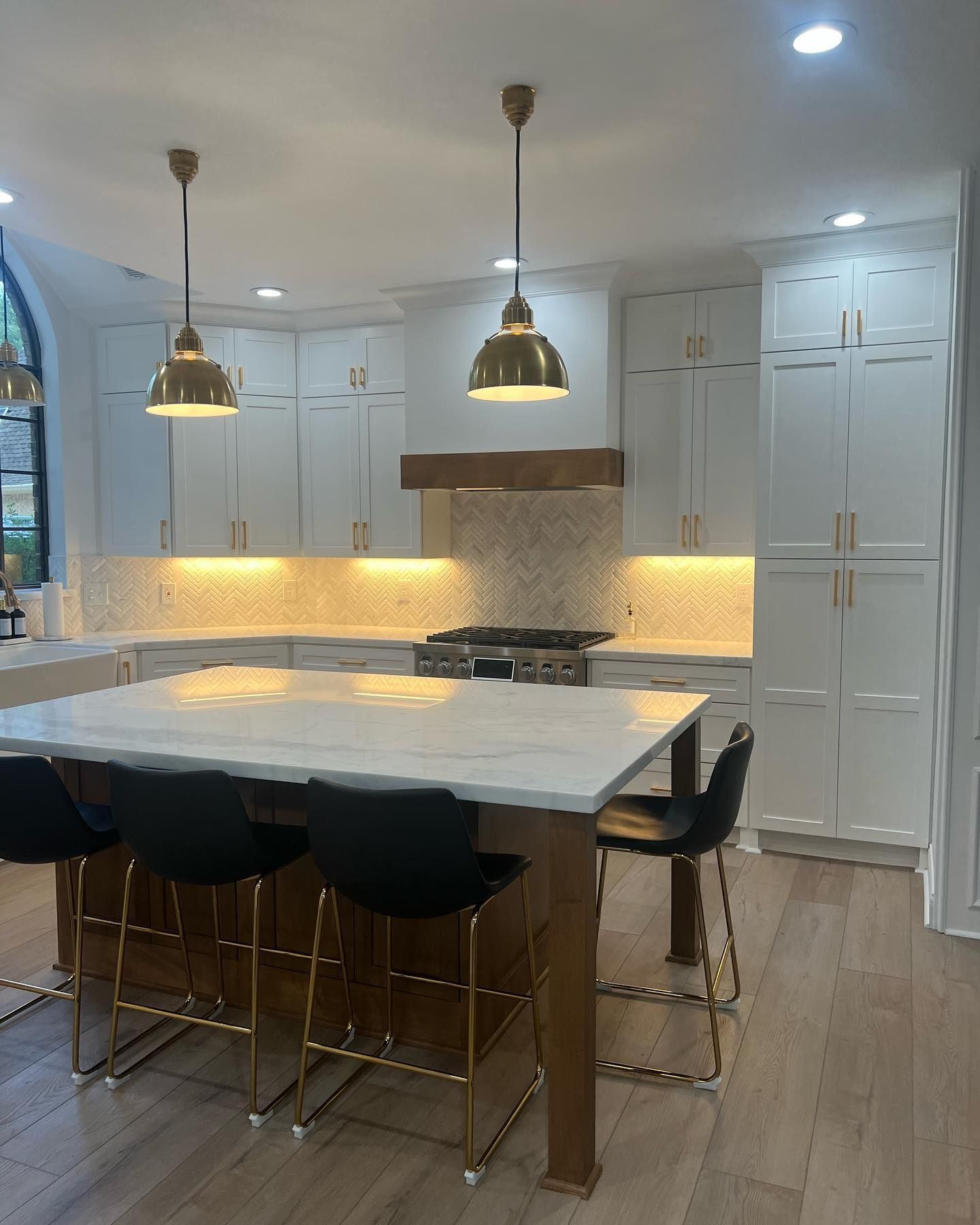 There is a large island in the middle of the kitchen.