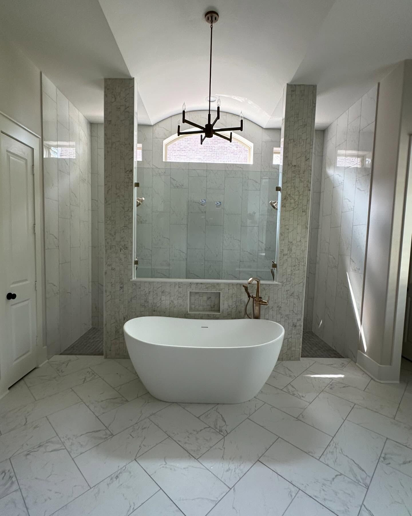 There is a bathtub in the middle of the bathroom.