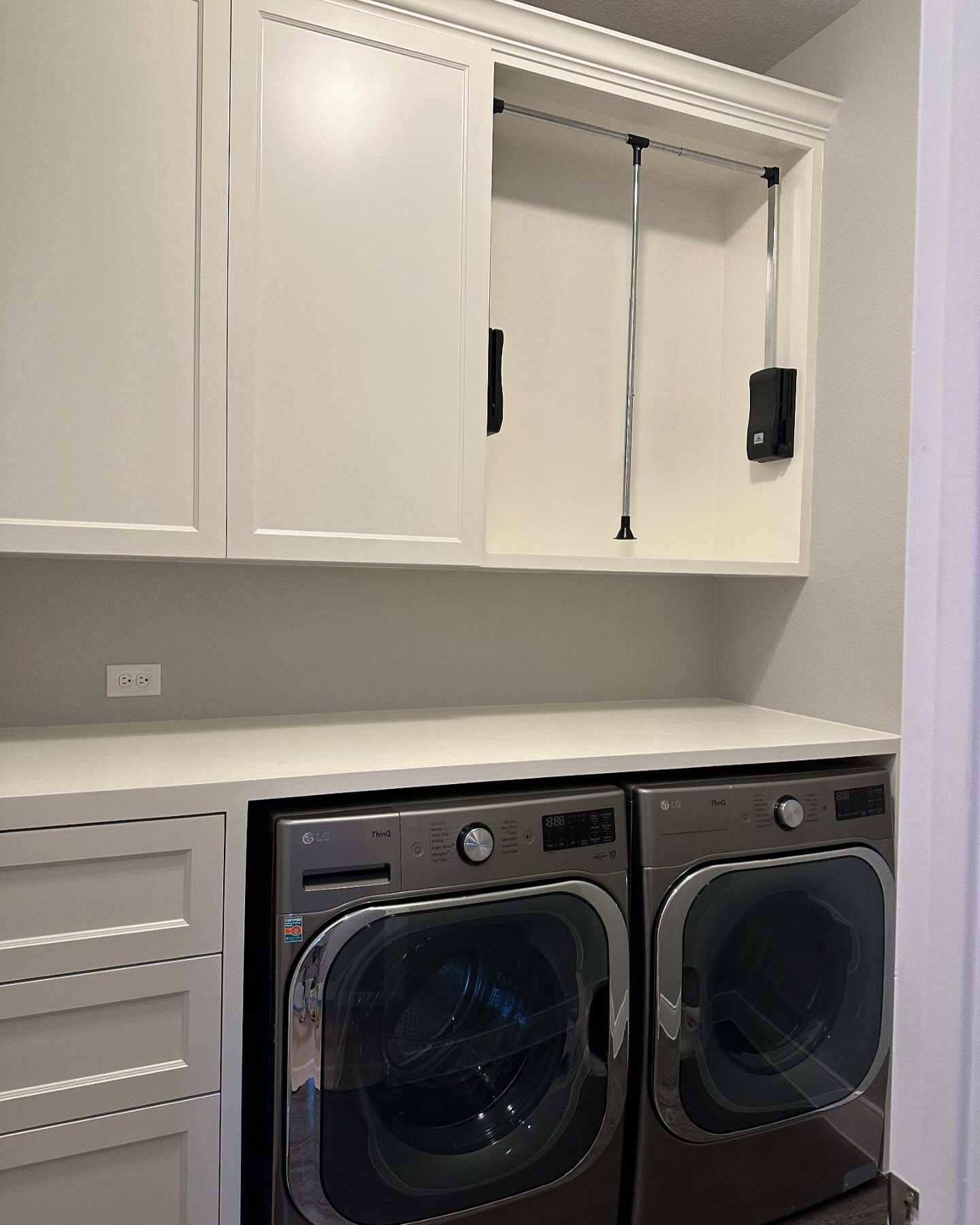 A laundry room with a washer and dryer in it