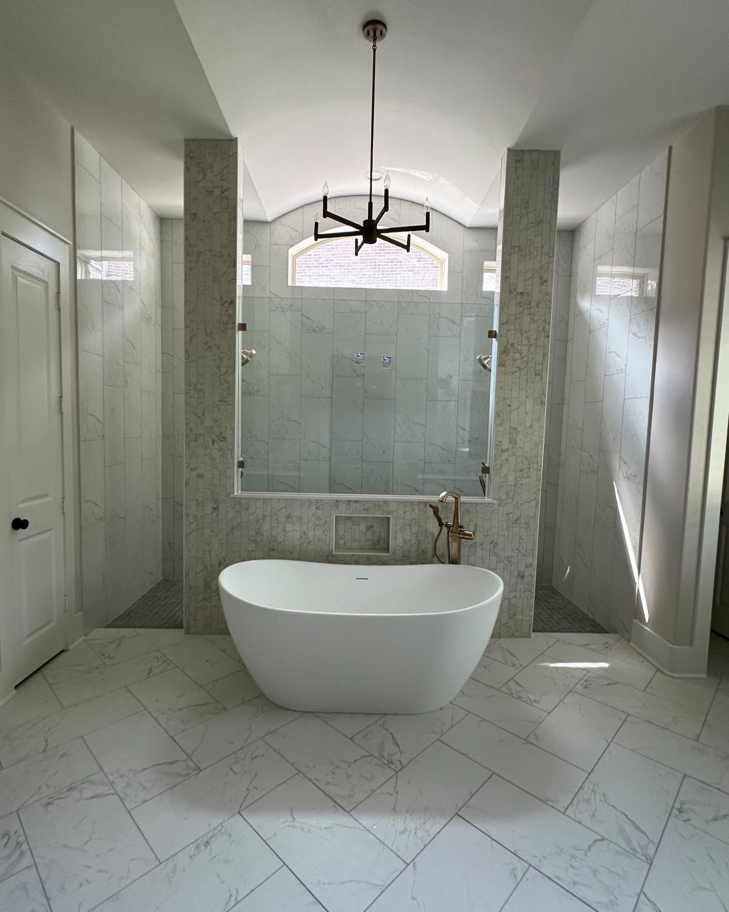 There is a bathtub in the middle of the bathroom.