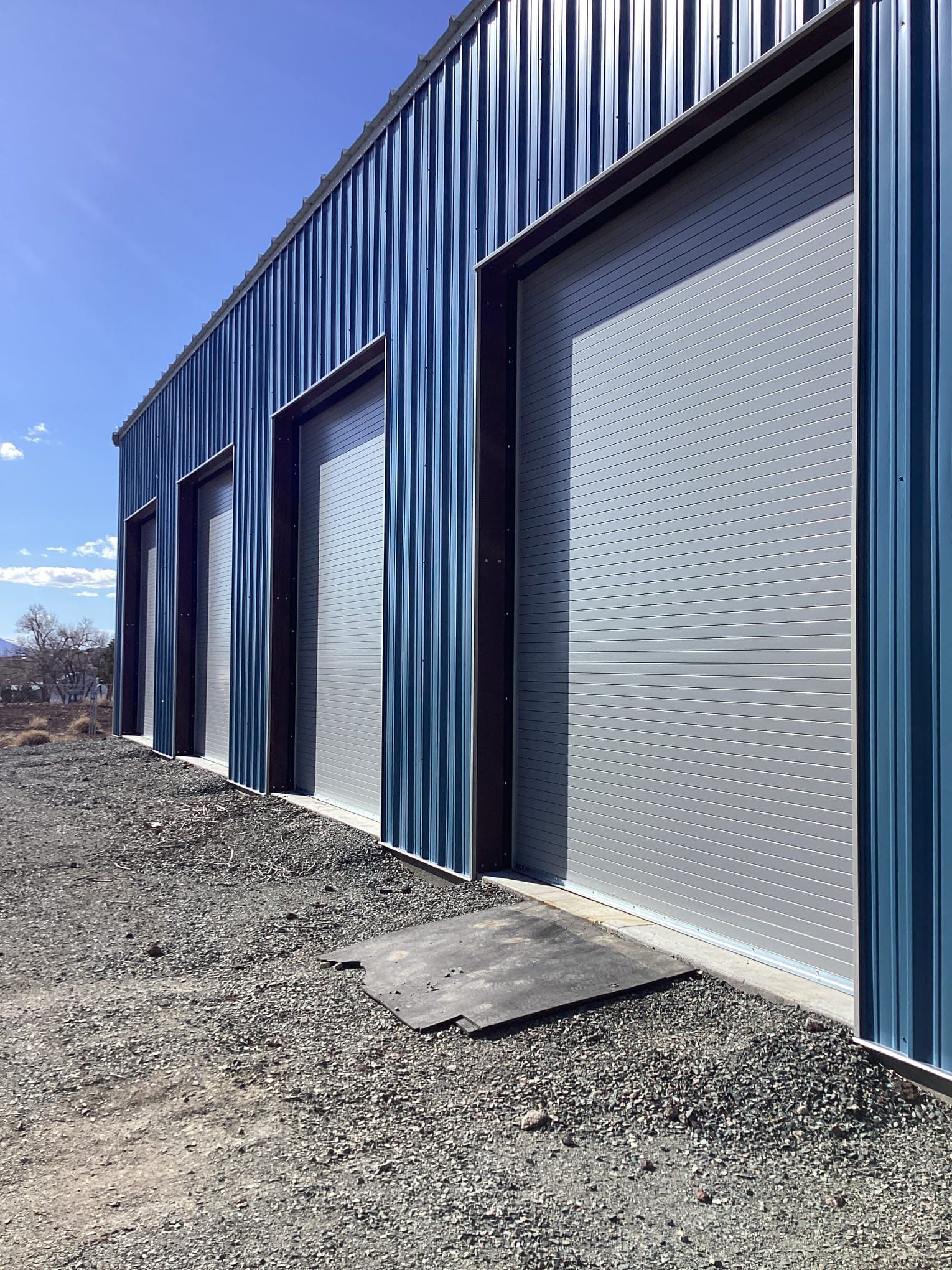 A row of garage doors on the side of a building.