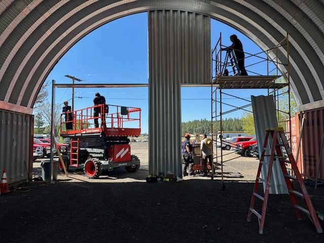 A group of construction workers are working on a building