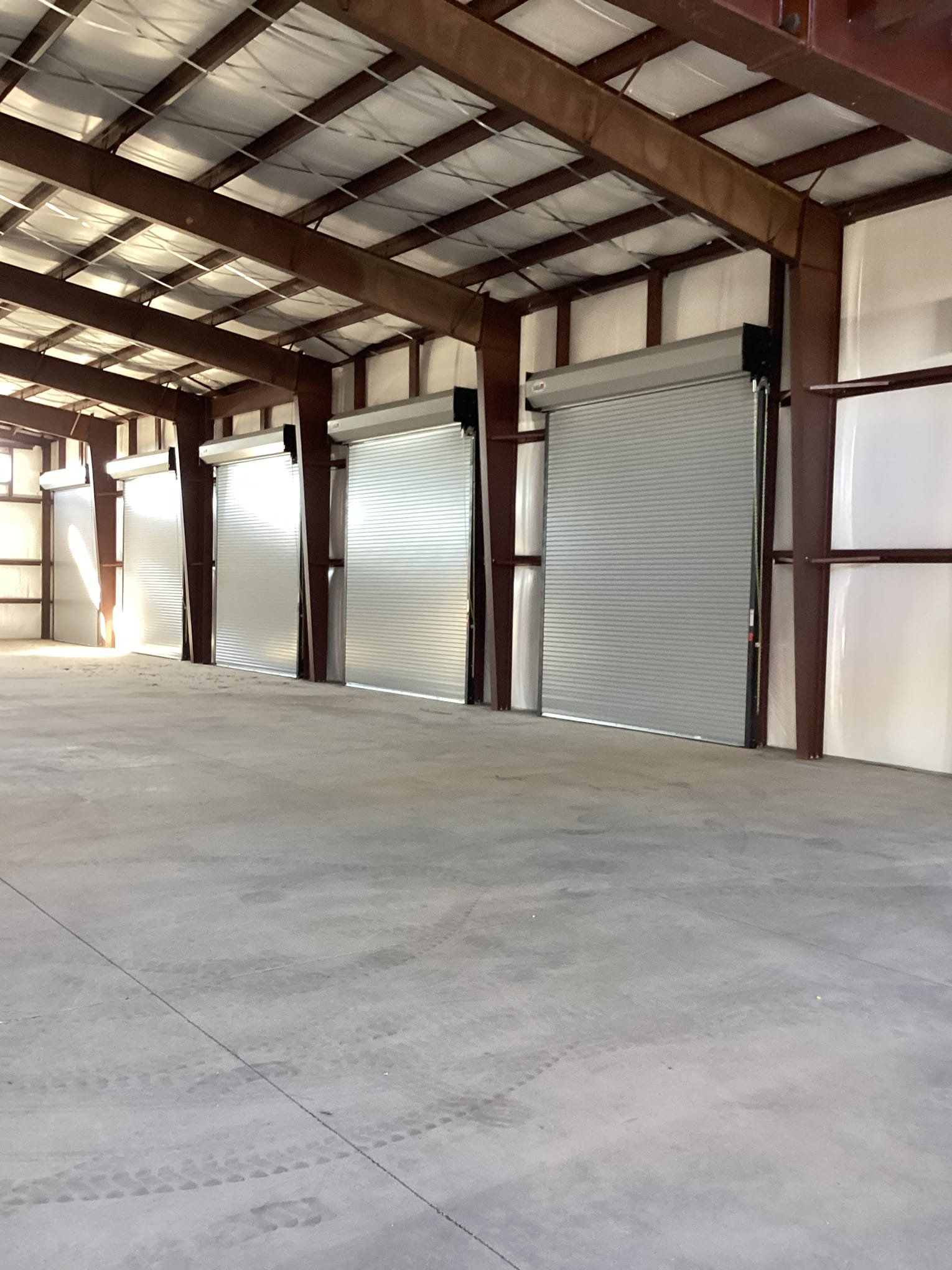 A Row Of Loading Doors On The Side Of A Building - Flagstaff, AZ - Loren Vickers