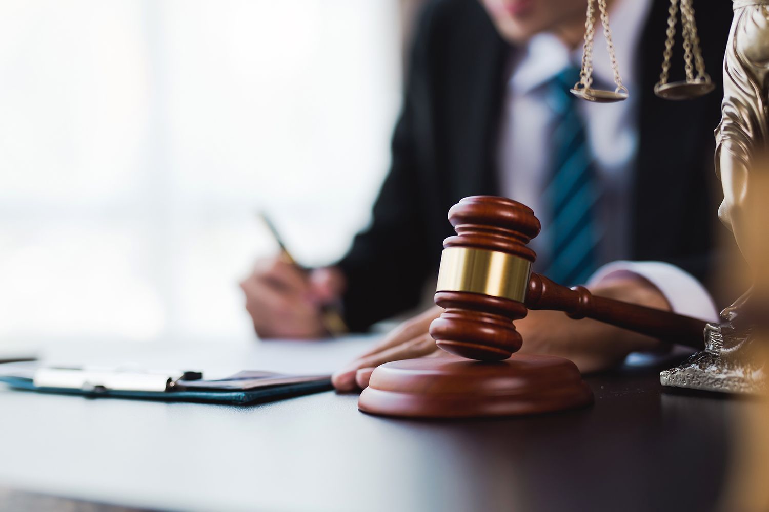 Close-up of a lawyer's desk with a gavel, symbolizing legal authority and bankruptcy law expertise.