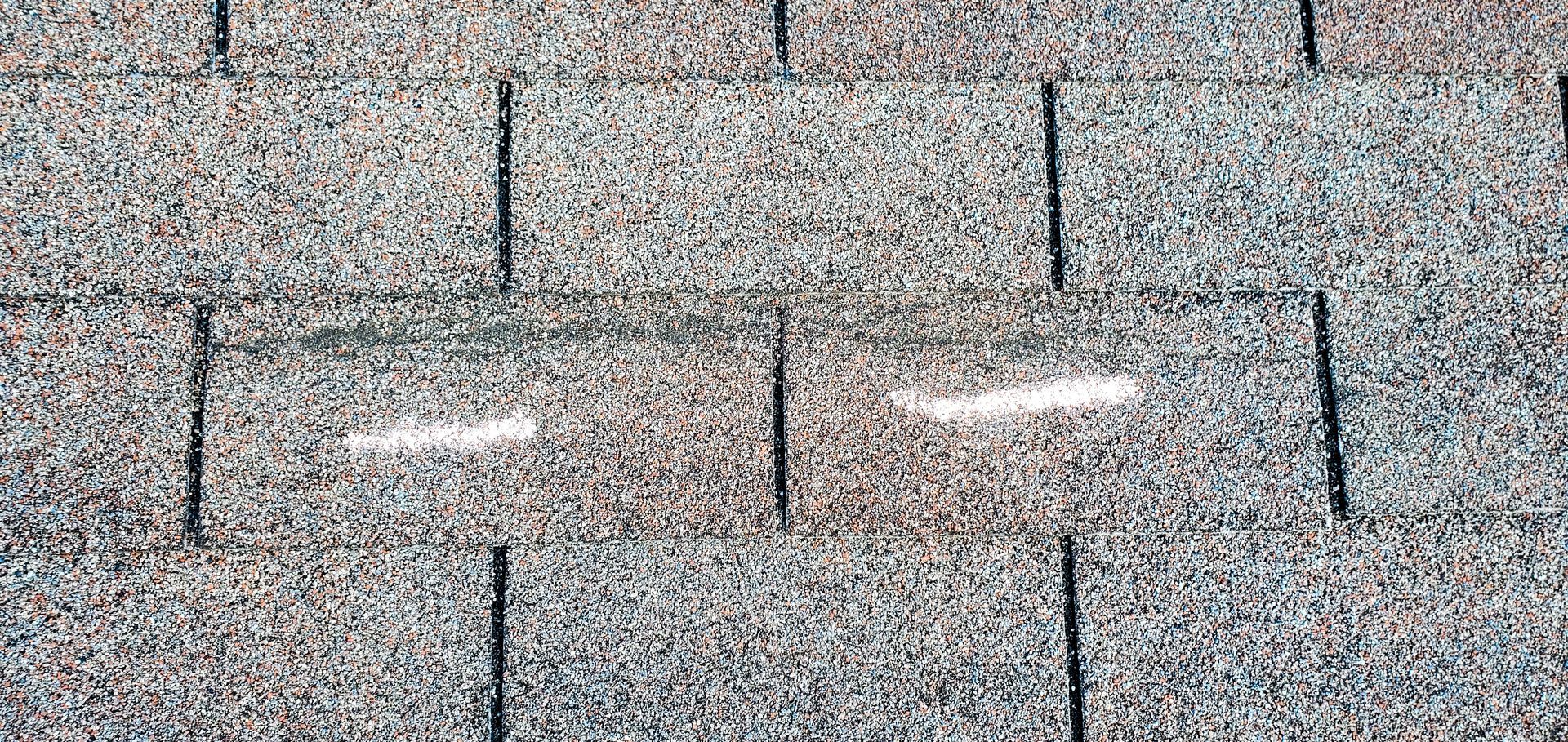 Merck roofing team repairing Wind damage roof in Atlanta, Georgia. 