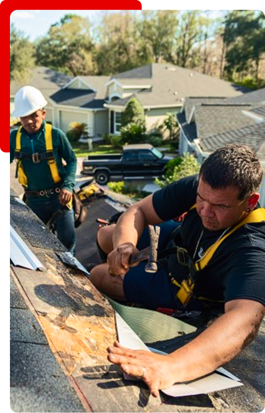 Merck Roofing specialists nailing down asphalt shingles for a residential project in Hall County, Georgia.