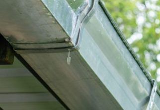 Moisture‑damaged fascia board gutter repair service in Atlanta, Georgia
