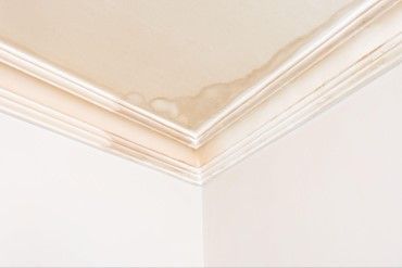 Interior ceiling water stain from residential roof storm damage in Atlanta, Georgia.