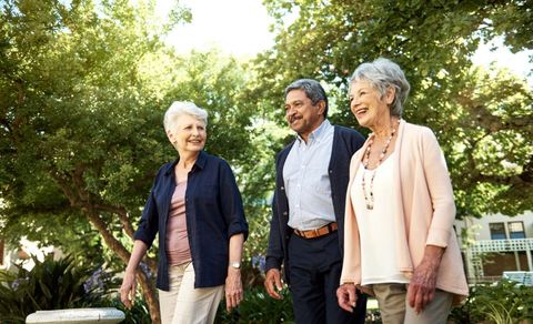 Shot of a group of senior friends going for a walk together in the garden