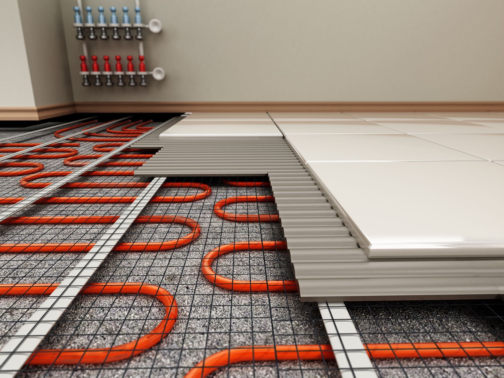 Stacked white floor panels over orange radiant heating tubes in a room under construction
