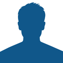 A blue silhouette of a man 's face on a white background.