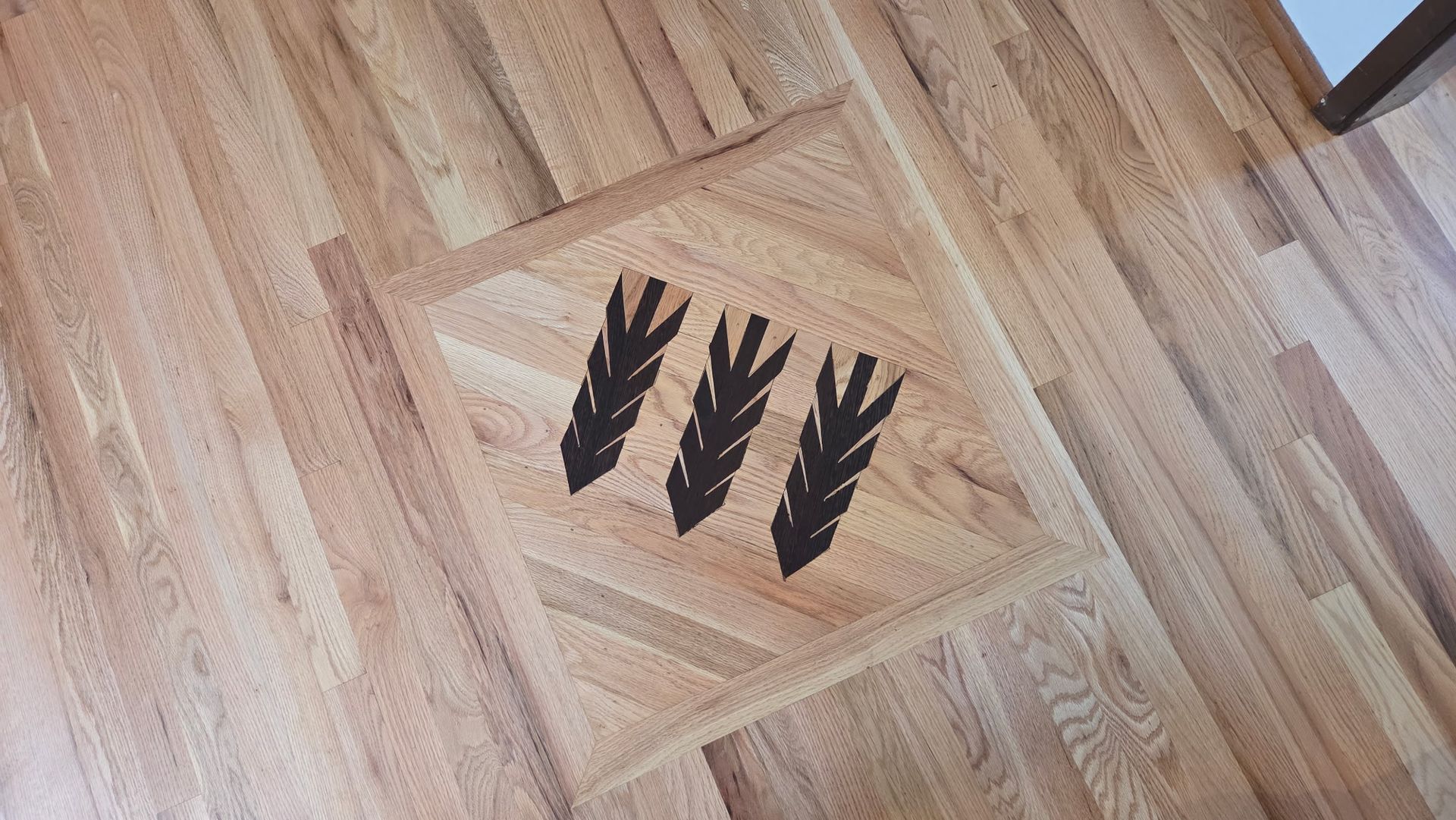 custom hardwood floor inlay in Bremerton, WA by Tullers' Hardwood Floors