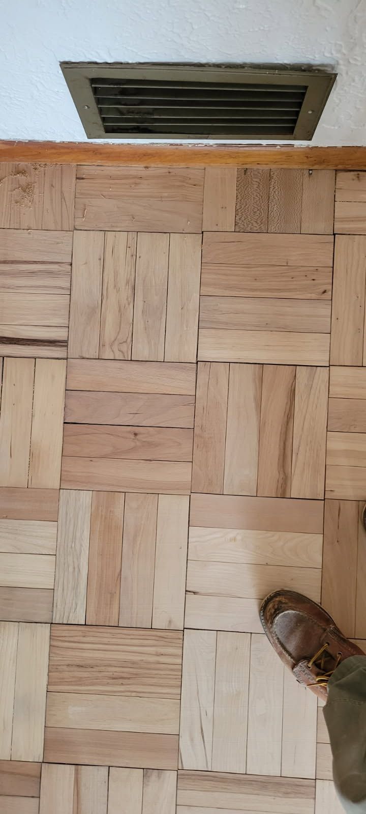 Parquet hardwood flooring pattern with natural wood tones installed by Tuller’s Hardwood Floors & Remodeling in Olympia WA