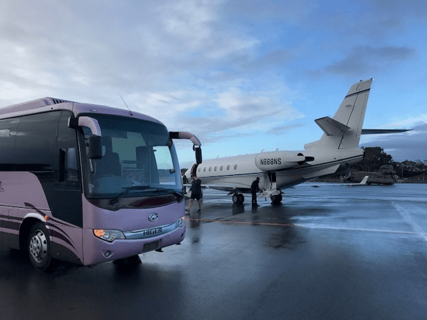 airport transfer bus hire on airport tarmac with  aeroplane