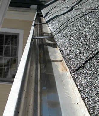 Gutter Cleaning — Newly Cleaned House Gutter in Bloomfield, MI