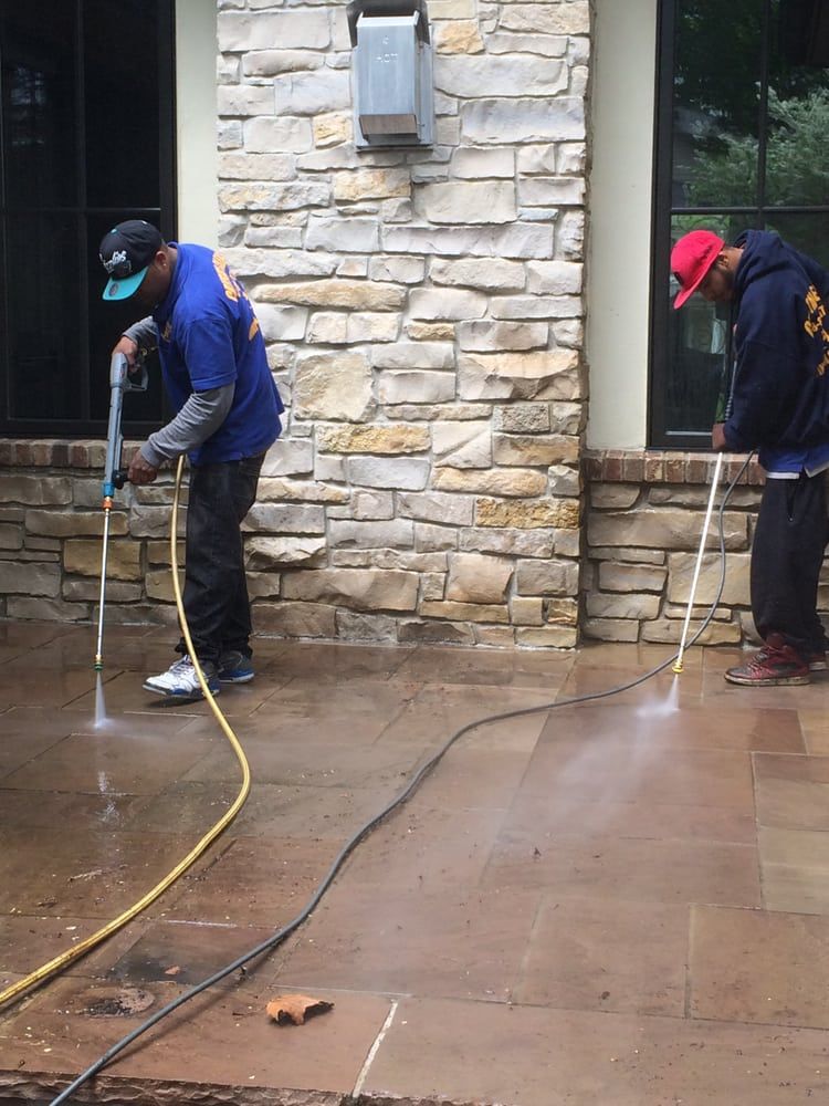 Power Washing — Two Men Cleaning Using High-Pressure Water Spray in Bloomfield, MI