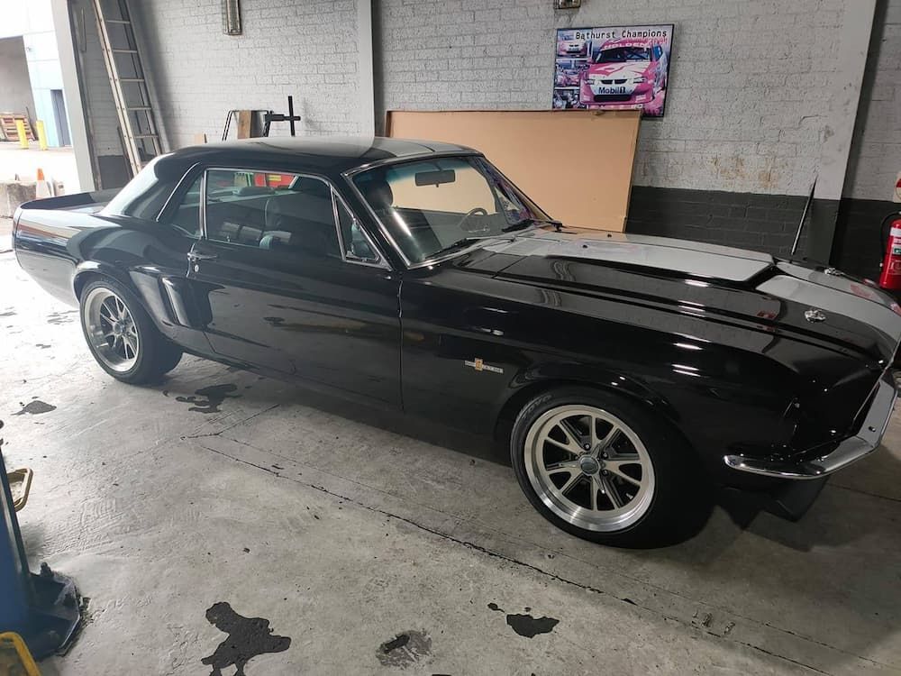 A Black Mustang Is Parked in A Garage — Andy's A1 Auto Care in Barrack Heights, NSW