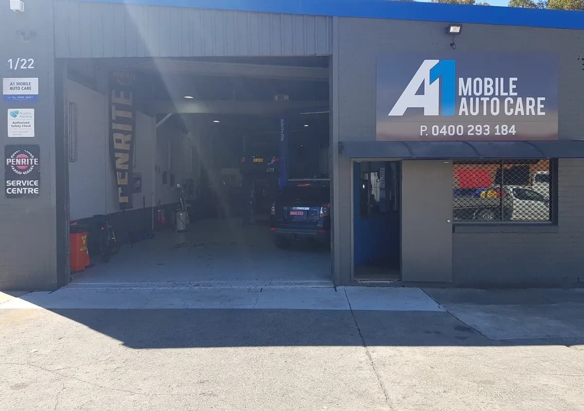 A Car Is Parked in The Garage of A Mobile Auto Care Shop — Andy's A1 Auto Care in Barrack Heights, NSW